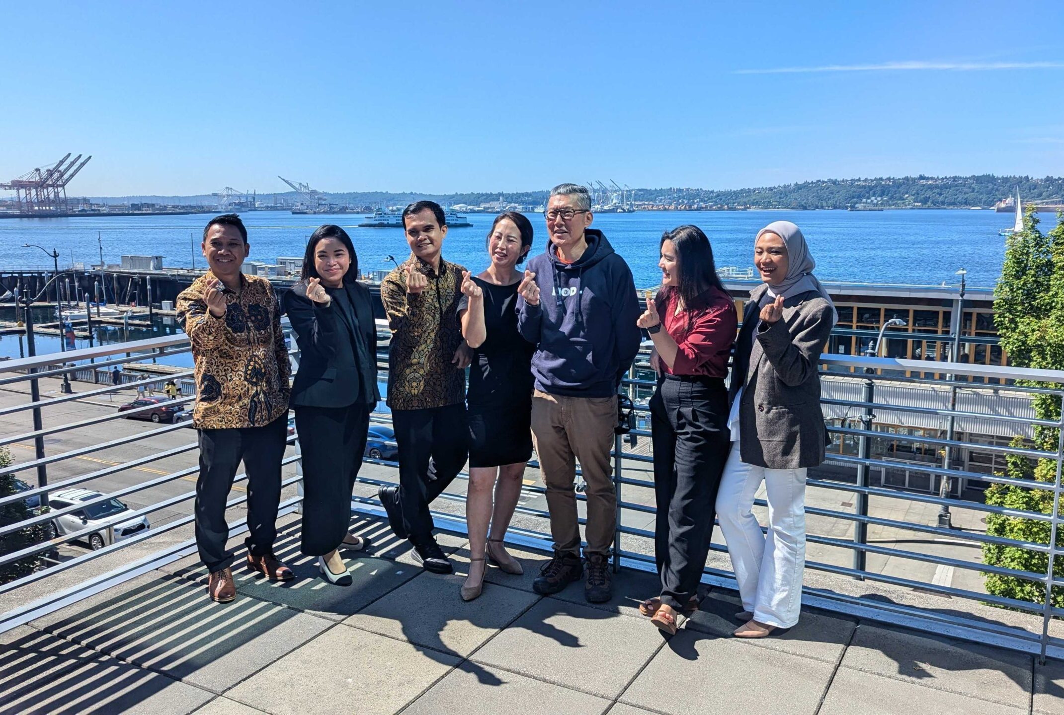 six IVLP participants posing with Arry Yu of the Washington Technology Industry Association